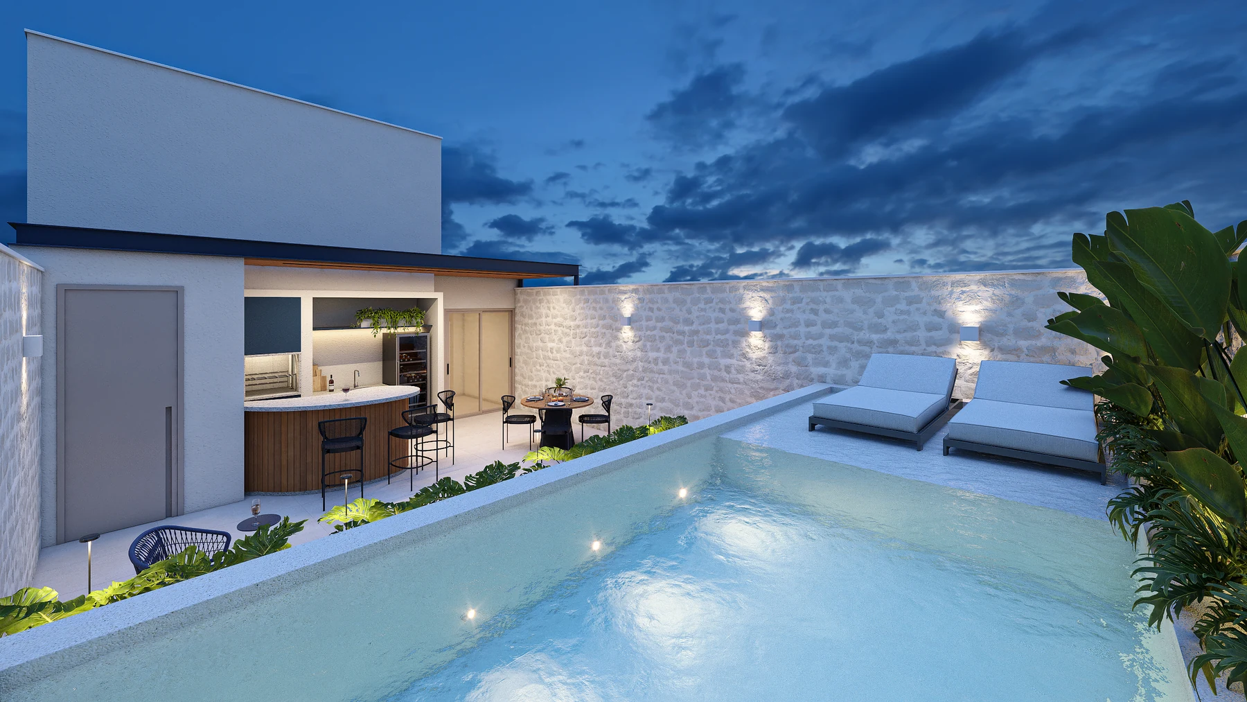 Piscina e terraço do Amaré Arpoador em vista noturna